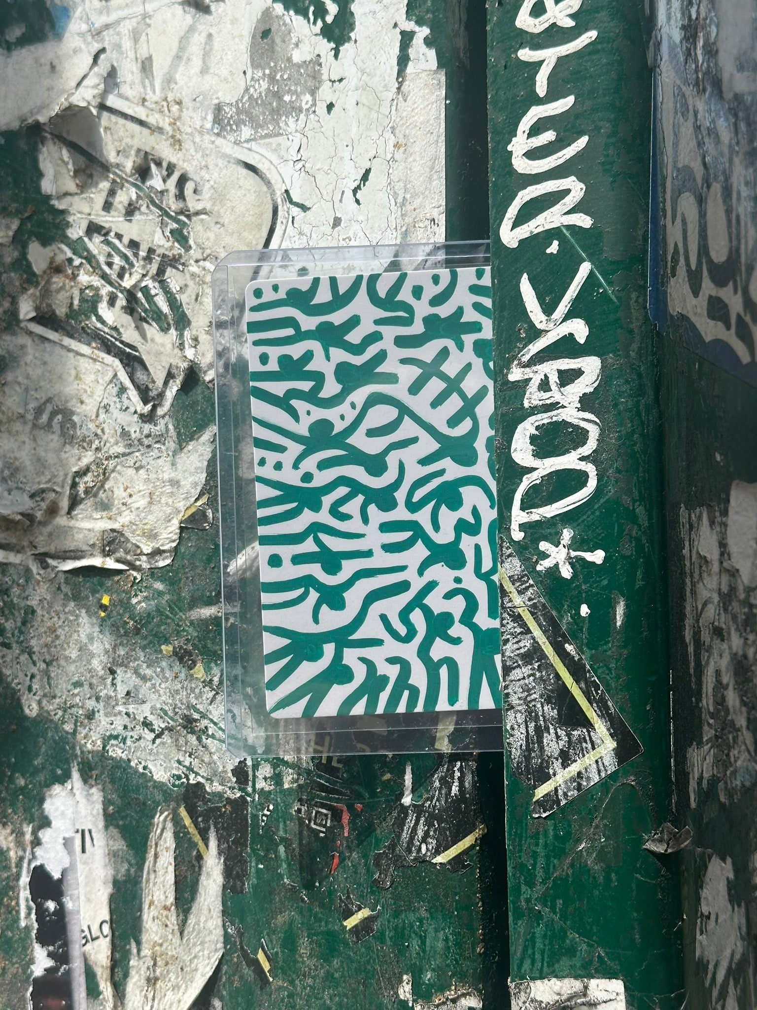 Seed of Possibility sketch card placed on a New York City street surface
